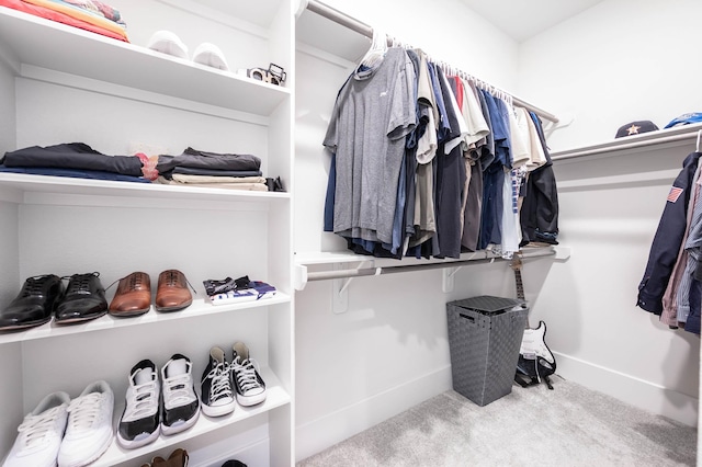 spacious closet with carpet floors