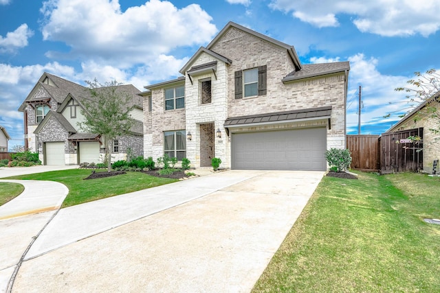 view of front of house with a front yard and a garage