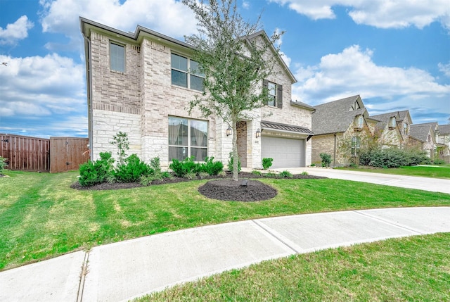 view of front of property with a garage and a front lawn