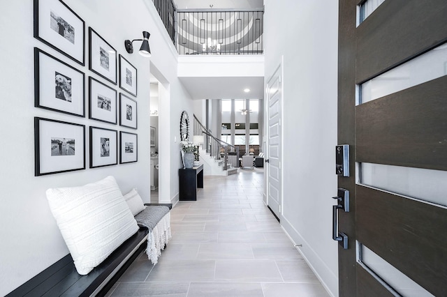 entrance foyer featuring a towering ceiling