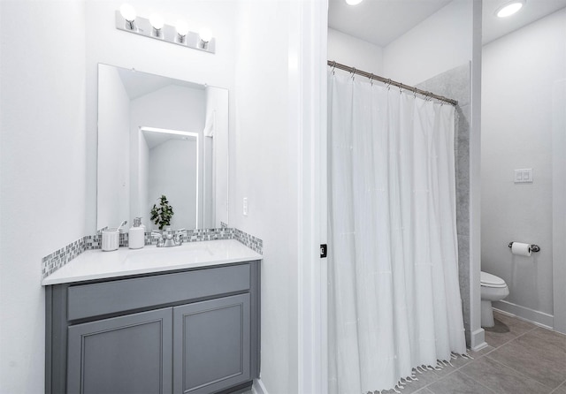 bathroom featuring tile patterned flooring, vanity, toilet, and a shower with shower curtain