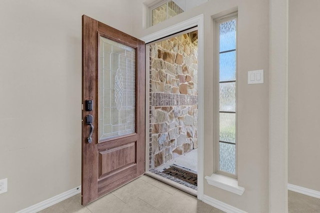 foyer with light tile patterned floors