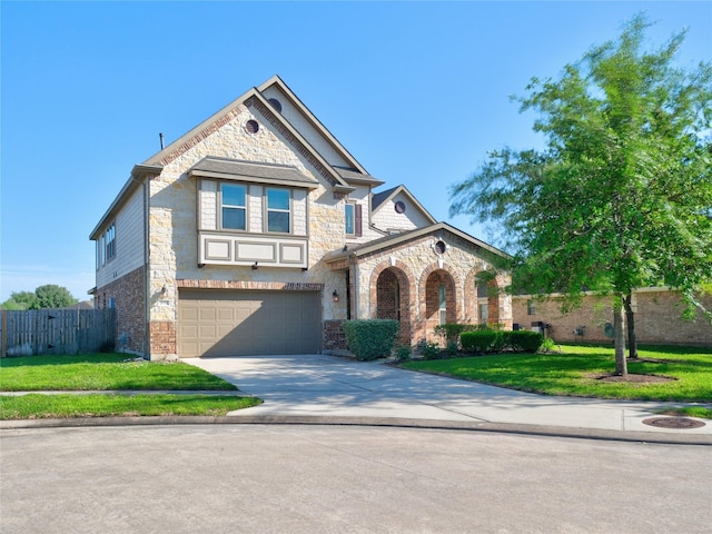 view of front of property featuring a front lawn and a garage