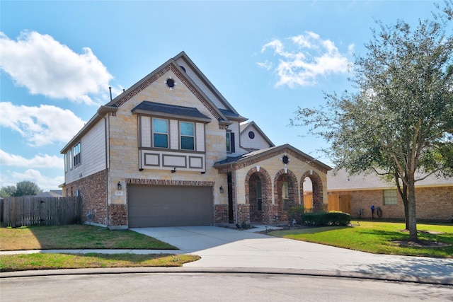 view of front facade with a garage and a front lawn