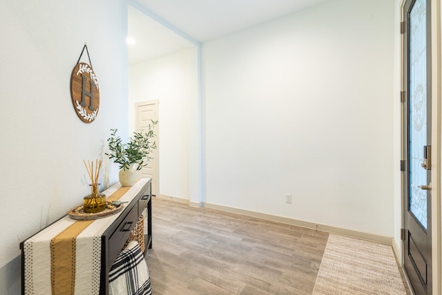 foyer entrance with light wood-type flooring