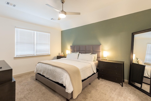 bedroom featuring light carpet, ceiling fan, and lofted ceiling