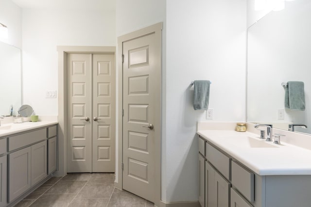 bathroom with tile patterned flooring and vanity