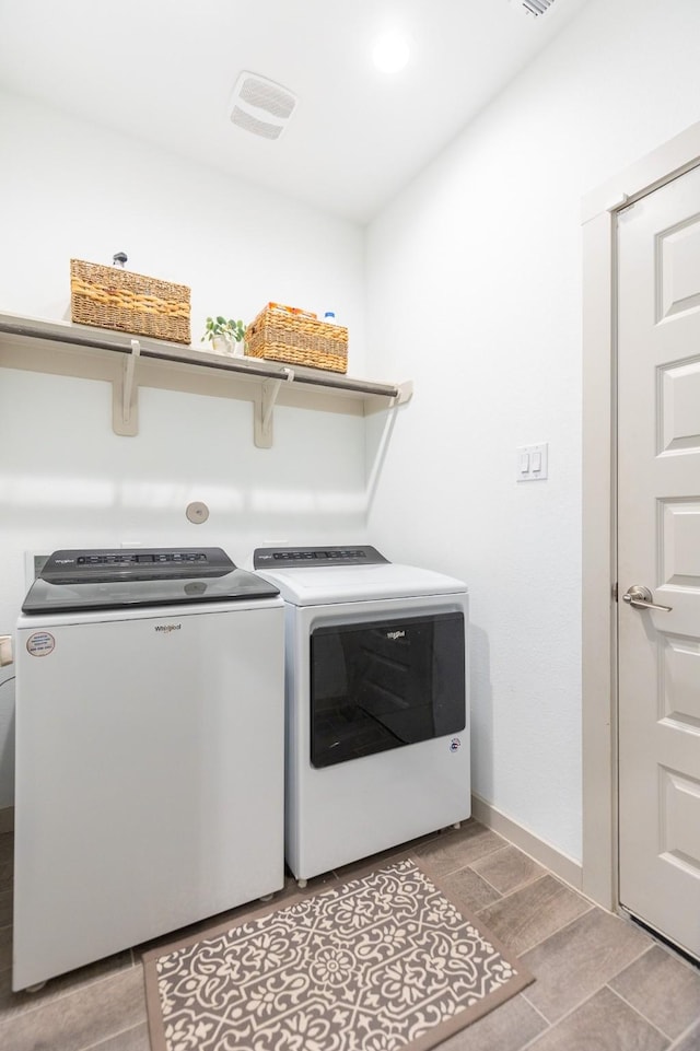 laundry area with washing machine and dryer