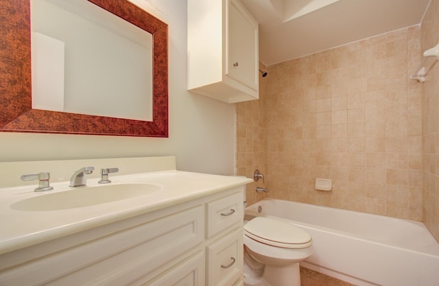 full bathroom featuring vanity, toilet, and tiled shower / bath combo