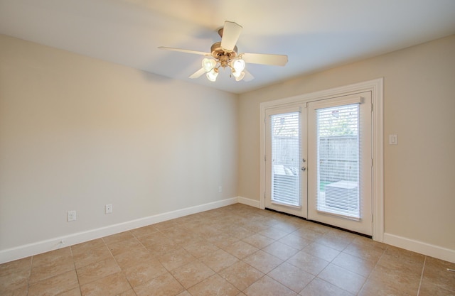 tiled empty room with french doors and ceiling fan