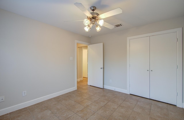 unfurnished bedroom featuring a closet and ceiling fan