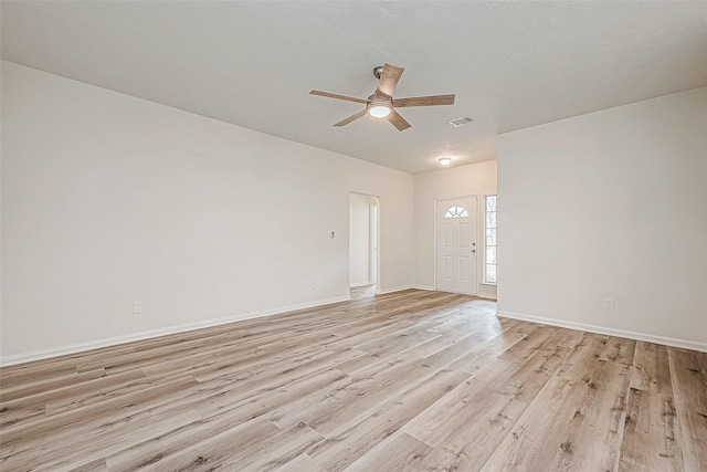 unfurnished room with ceiling fan and light hardwood / wood-style floors