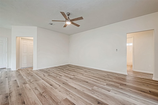 unfurnished room with light hardwood / wood-style flooring and ceiling fan