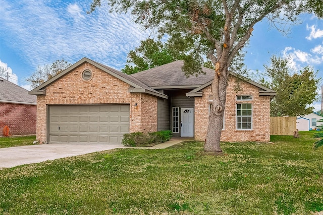 view of front of house featuring a garage and a front yard