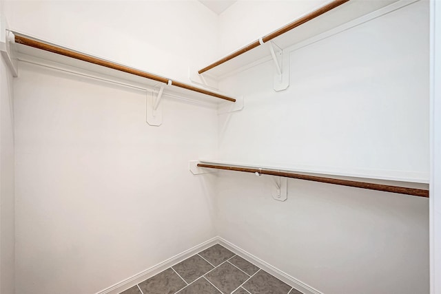 spacious closet featuring tile patterned floors