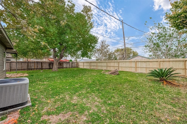 view of yard featuring central AC unit