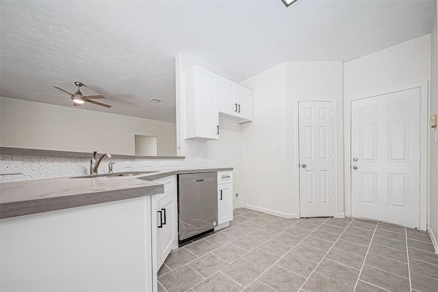 kitchen featuring ceiling fan, dishwasher, sink, light tile patterned floors, and white cabinets