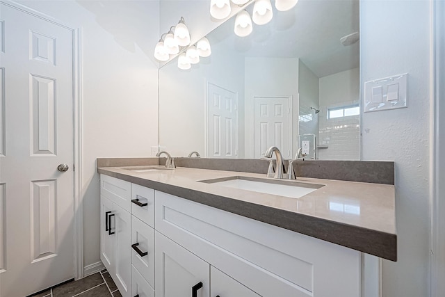 bathroom featuring a shower, vanity, and tile patterned floors