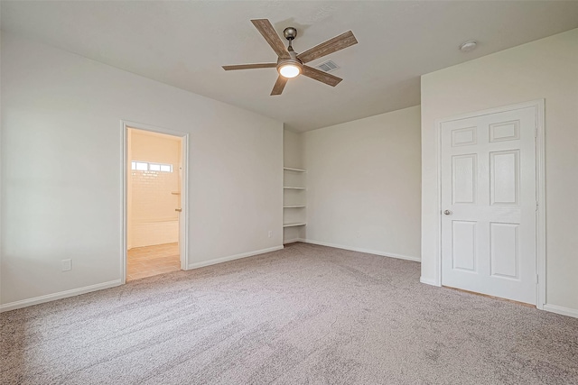 unfurnished bedroom with ceiling fan and carpet floors