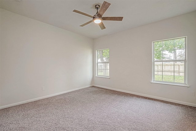 carpeted empty room with ceiling fan