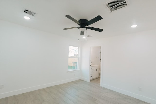 unfurnished room with ceiling fan and light hardwood / wood-style floors