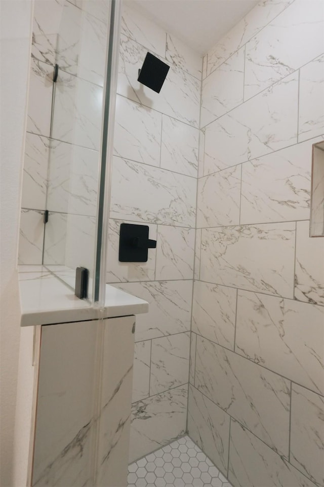 bathroom with a tile shower