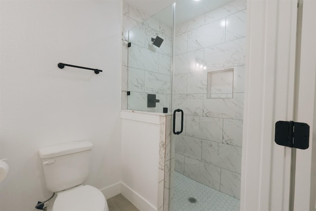 bathroom with toilet and walk in shower