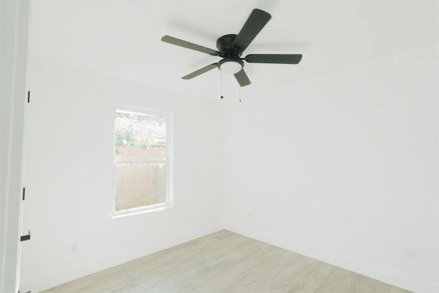 unfurnished room with light wood-type flooring and ceiling fan