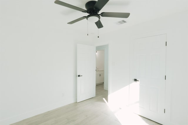 unfurnished bedroom featuring ceiling fan and light wood-type flooring