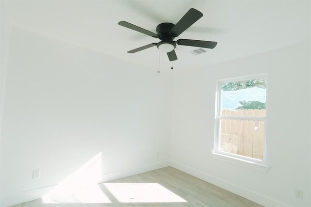 spare room featuring ceiling fan and light hardwood / wood-style flooring