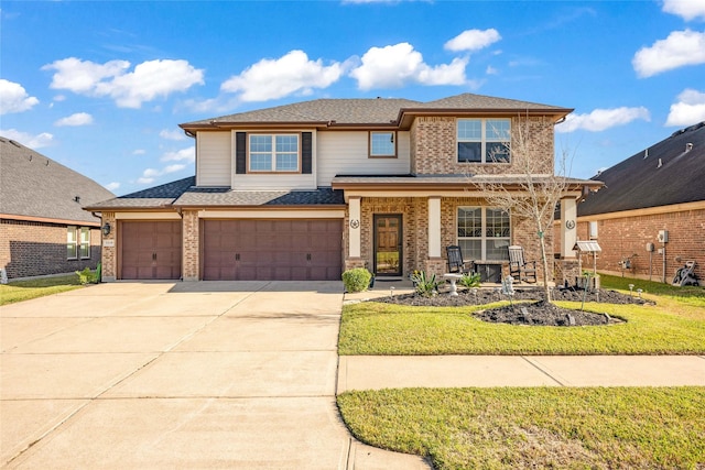 view of property with a porch, a garage, and a front lawn