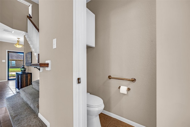 bathroom featuring tile patterned floors and toilet