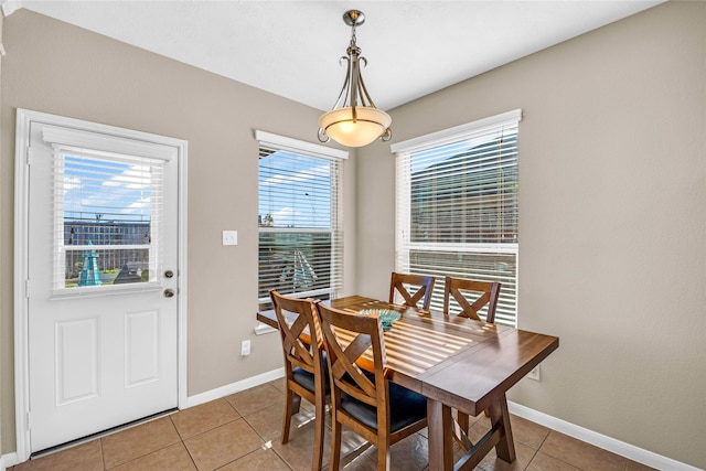 dining area with light tile patterned flooring