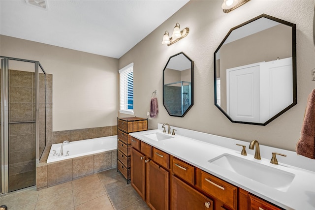 bathroom featuring tile patterned floors, vanity, and plus walk in shower