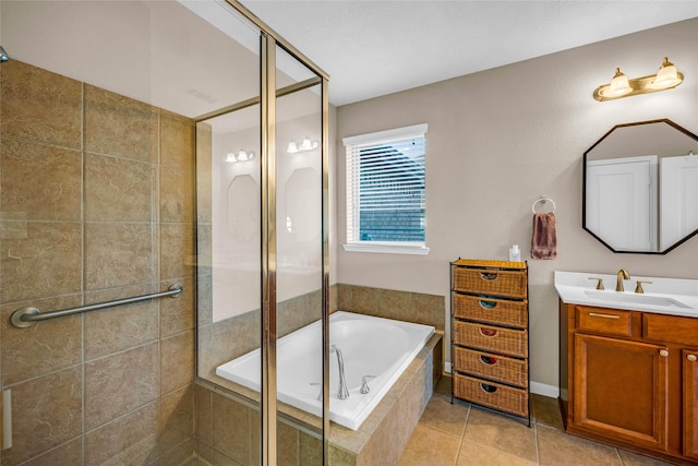 bathroom featuring tile patterned floors, vanity, and shower with separate bathtub