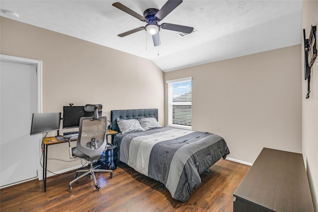 bedroom with lofted ceiling, ceiling fan, and dark hardwood / wood-style floors