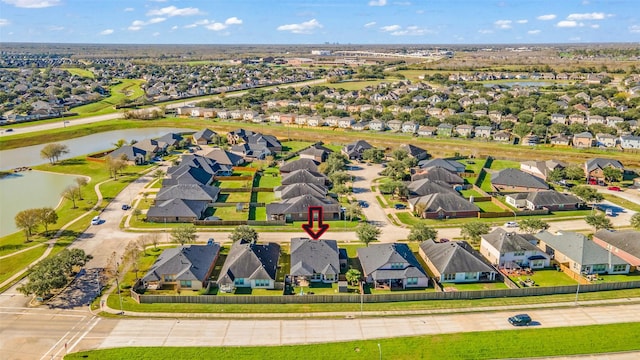 birds eye view of property featuring a water view