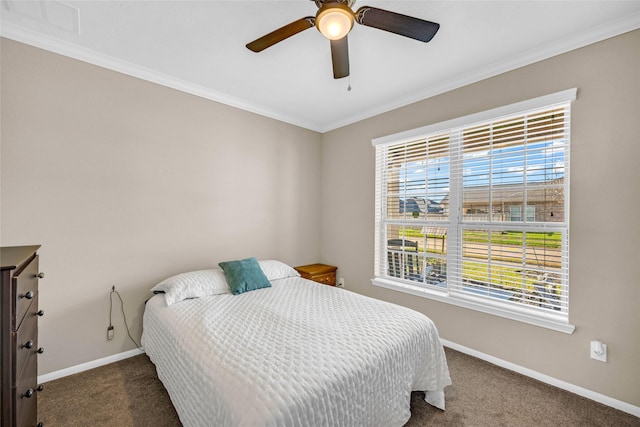 bedroom with dark colored carpet, ceiling fan, and crown molding