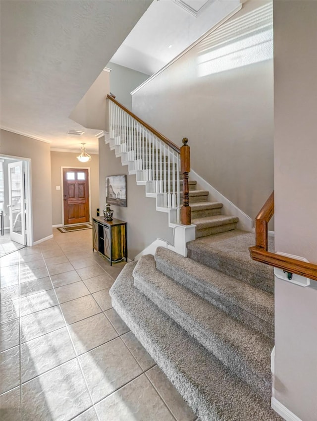 stairway featuring tile patterned flooring