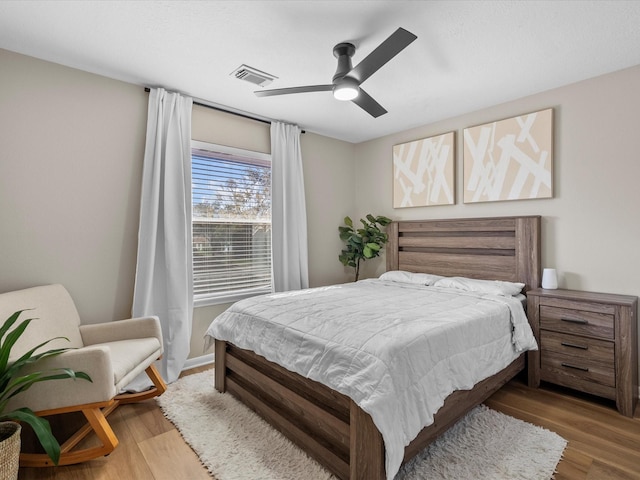 bedroom featuring ceiling fan and hardwood / wood-style floors