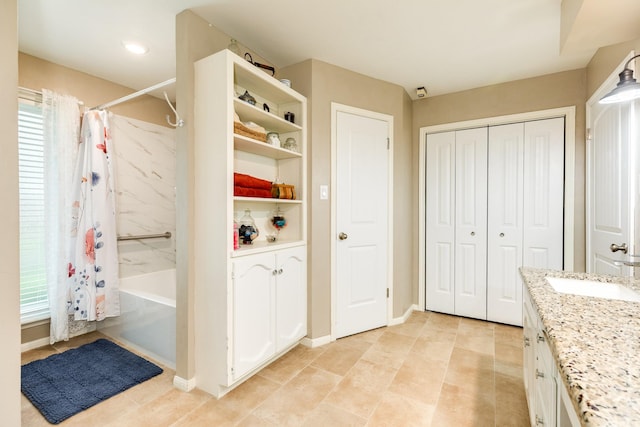 bathroom featuring shower / bath combination with curtain and vanity