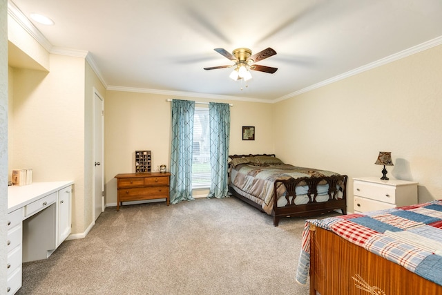 carpeted bedroom featuring ceiling fan and crown molding