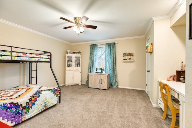 carpeted bedroom with ceiling fan and ornamental molding