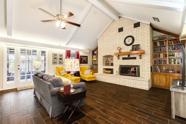 living room with ceiling fan, a fireplace, and lofted ceiling with beams