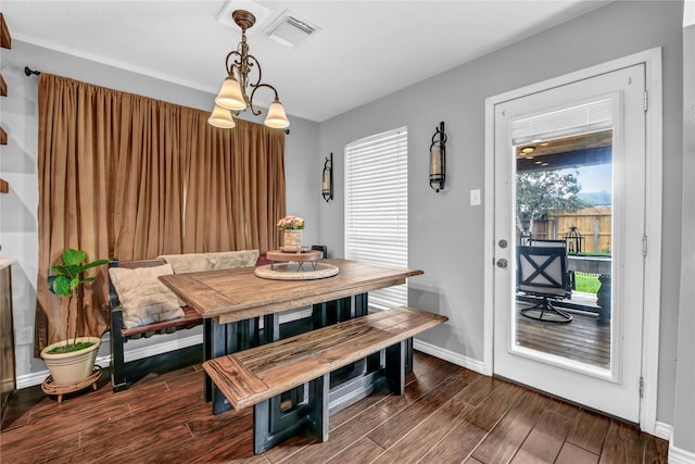 dining area featuring a chandelier