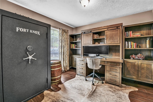 office featuring dark wood-type flooring and a textured ceiling