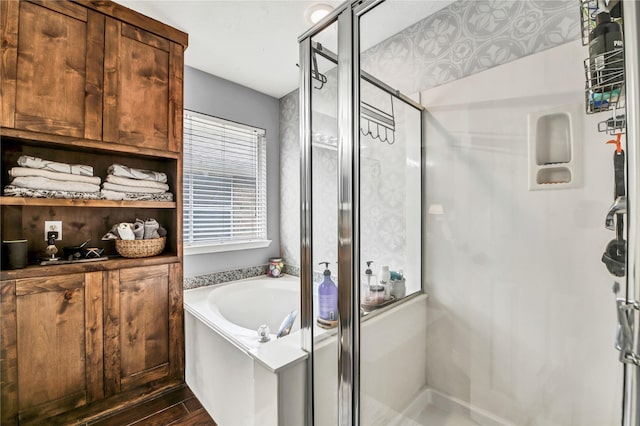 bathroom featuring wood-type flooring and independent shower and bath