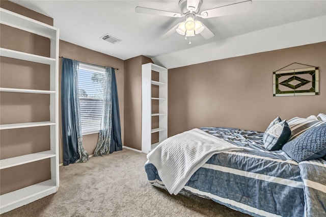 carpeted bedroom featuring ceiling fan and lofted ceiling