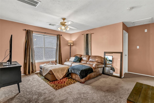 bedroom featuring carpet flooring, a textured ceiling, and ceiling fan