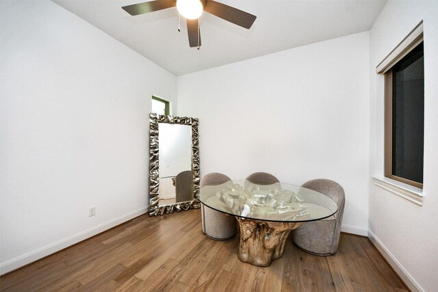 dining area featuring hardwood / wood-style flooring and ceiling fan